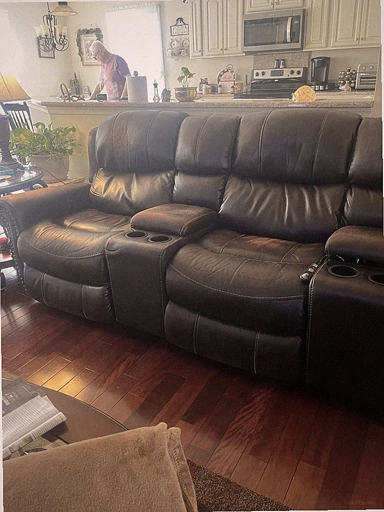 Brown sectional sofa With 3 Power Recliners.